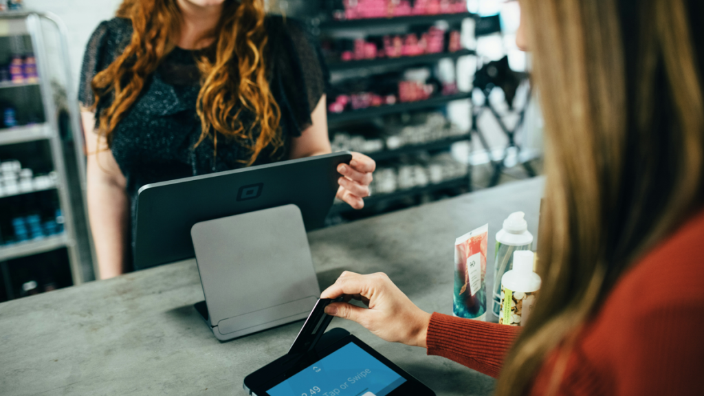 Women at store checkout counter