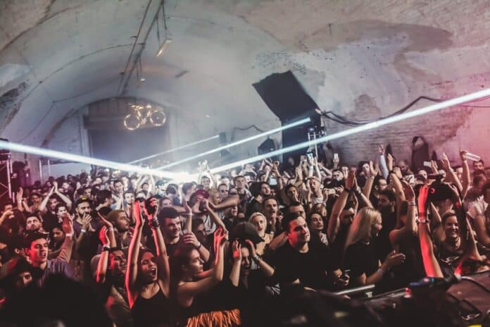 Concert crowd with raised hands