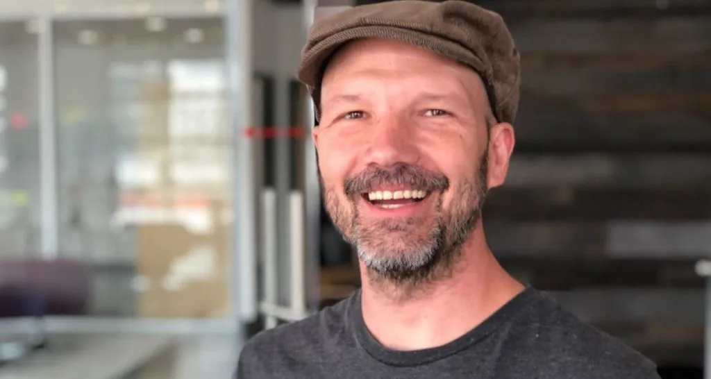 Chris McMurtry smiling with brown cap