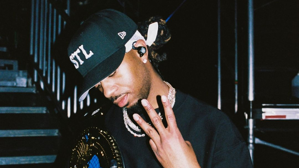 Metro Boomin wearing black hat