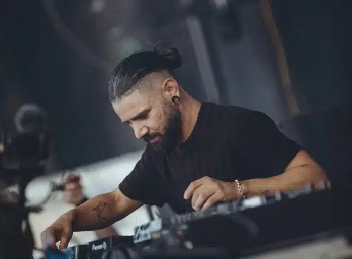 Skrillex performing at DJ equipment