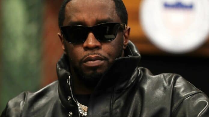 Diddy wearing leather jacket, looking serious