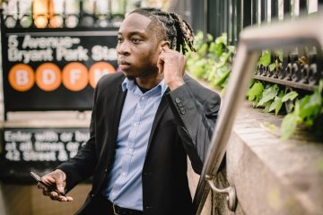 Businessman checking phone with charts