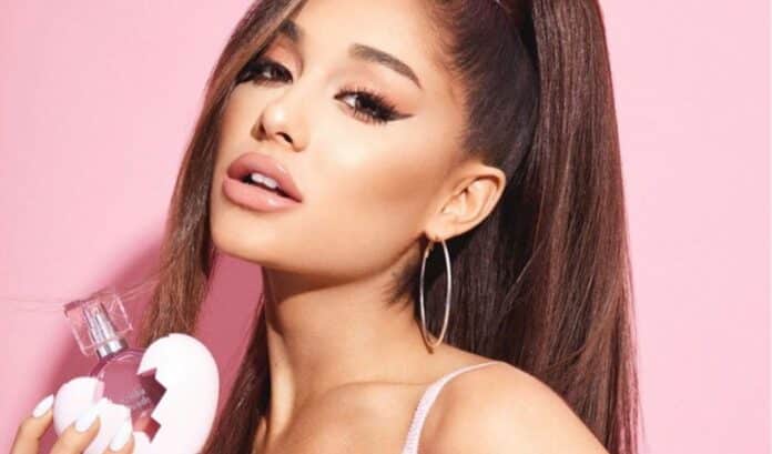 Ariana Grande displays new fragrance bottle