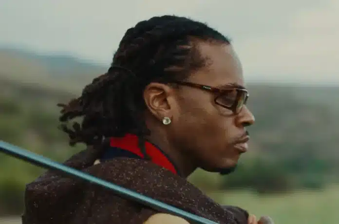 Gunna wearing sunglasses and dreadlocks