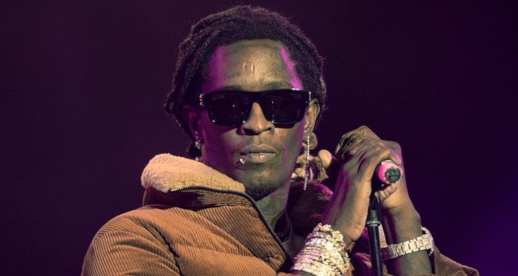 Young Thug performing with mic