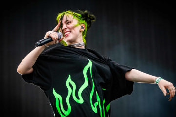 Billie Eilish singing with microphone