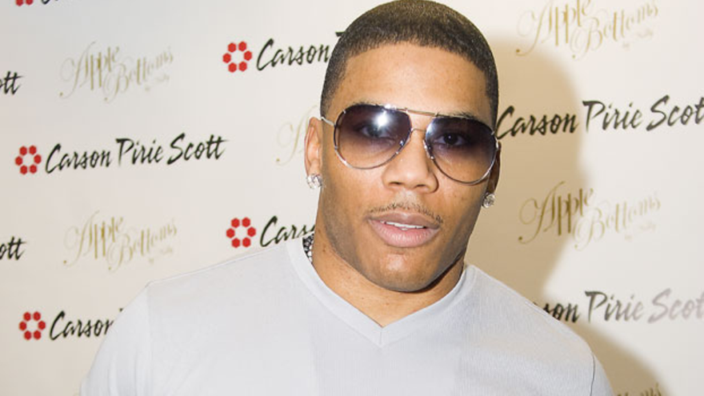 Nelly wearing white during press appearance