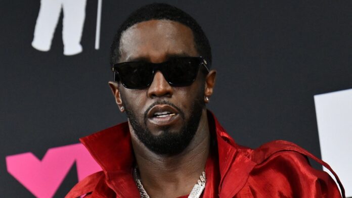 P Diddy wearing red jacket