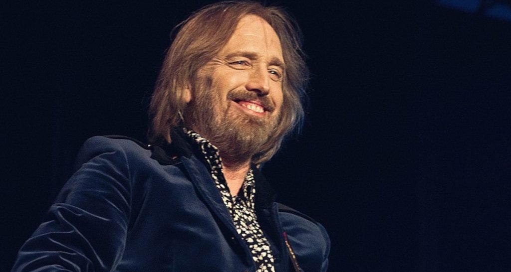 Tom Petty performing on stage