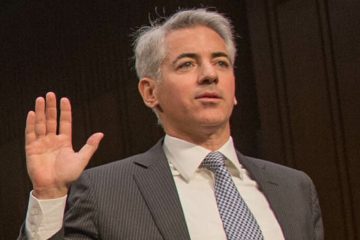 Bill Ackman gestures in business suit