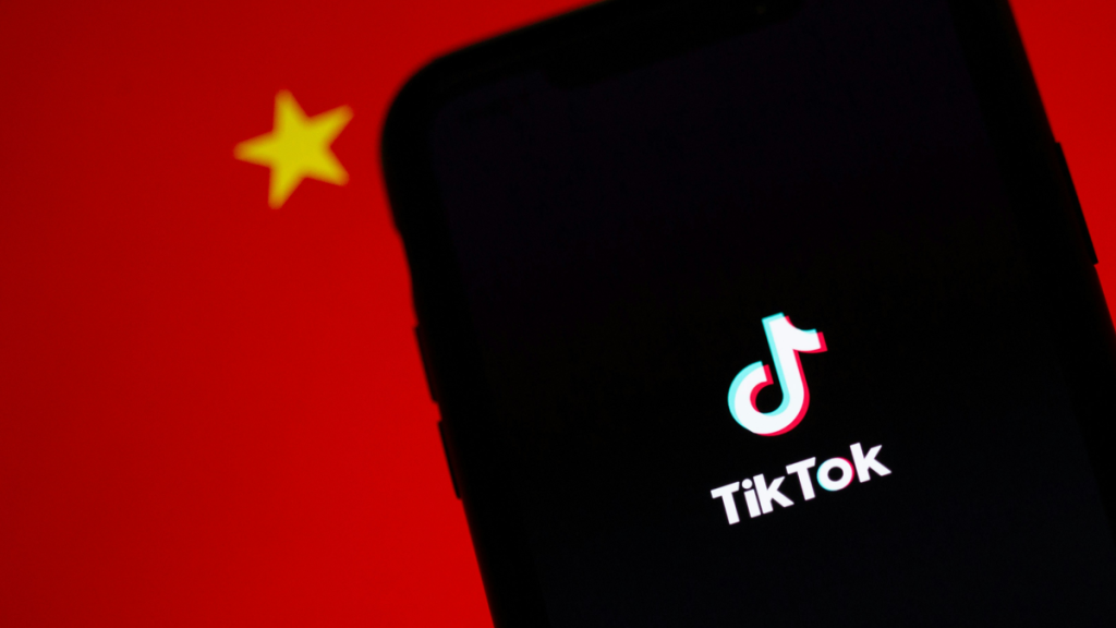 TikTok logo against dark background