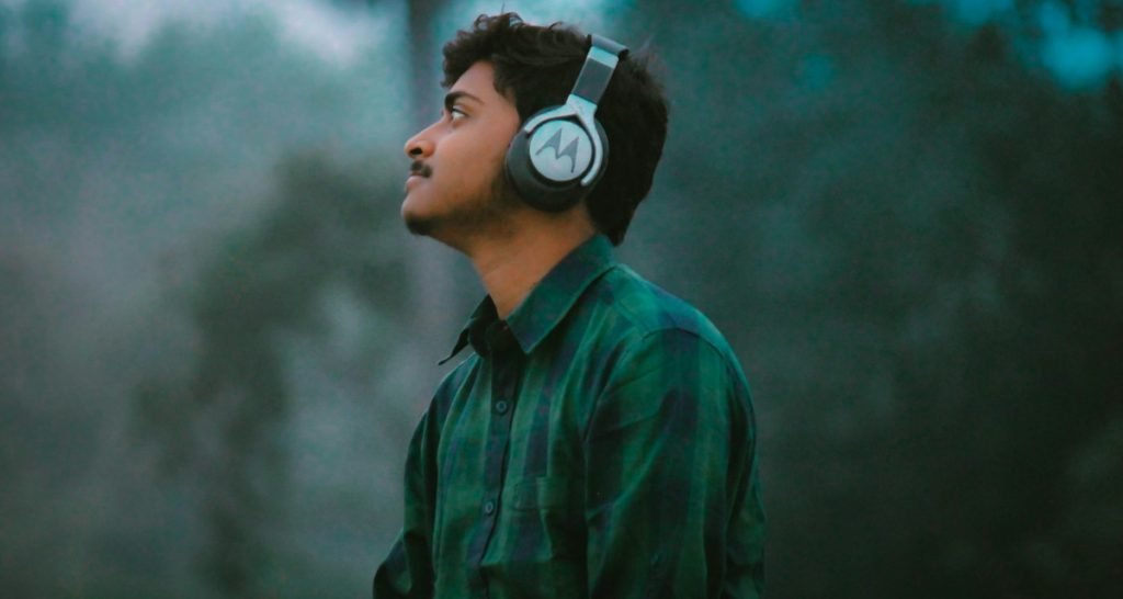 Man wearing headphones outdoors