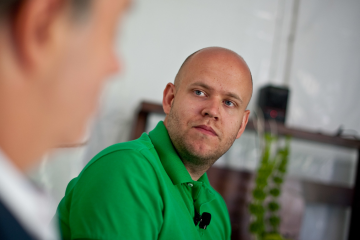 Man wearing green shirt at screen