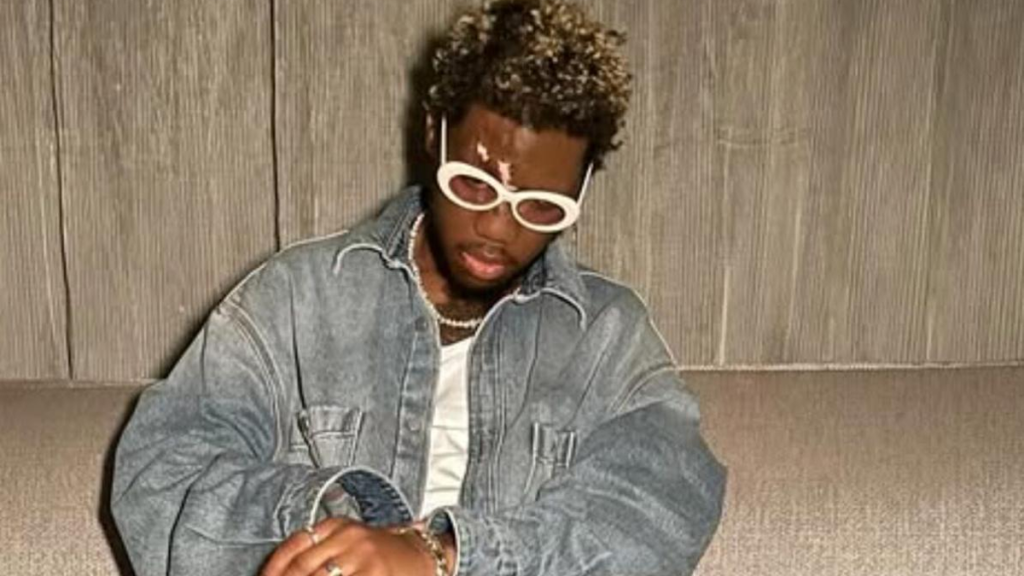 Rapper OG Maco wearing denim jacket