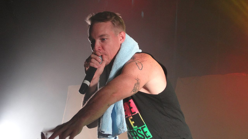 Diplo speaking into a microphone