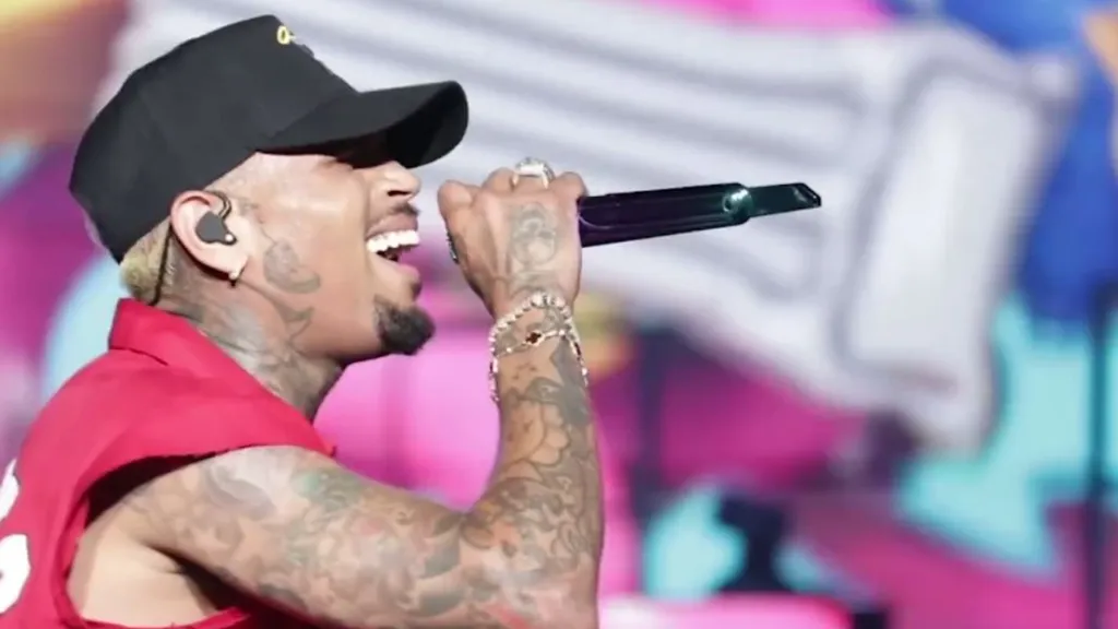 Chris Brown singing with microphone